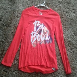 Orangish redish long sleve shirt